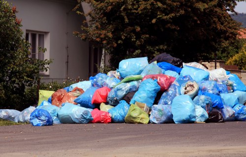 Rubbish removal team collecting waste under service terms
